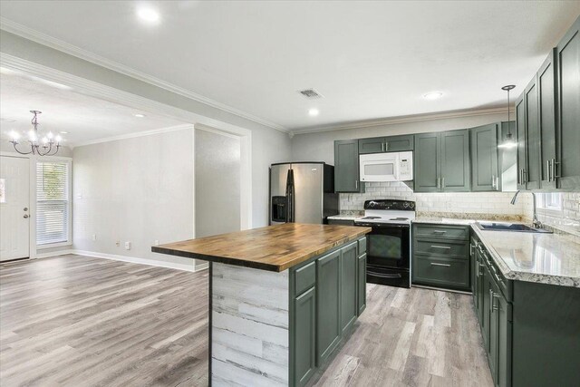 kitchen featuring a center island, white appliances, wooden counters, sink, and light hardwood / wood-style floors