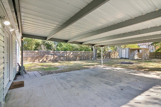 view of patio featuring a storage shed