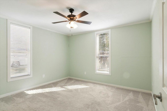 unfurnished room featuring light carpet, ceiling fan, and ornamental molding