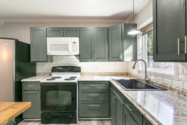 kitchen featuring sink, electric range, decorative backsplash, light stone countertops, and stainless steel refrigerator