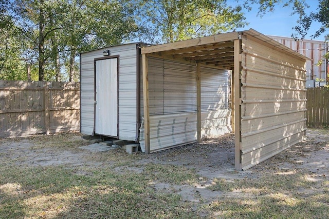 view of outbuilding featuring a carport