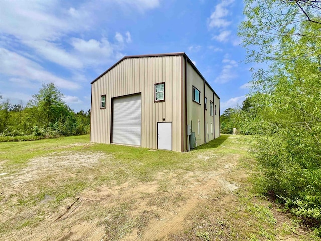 detached garage featuring driveway