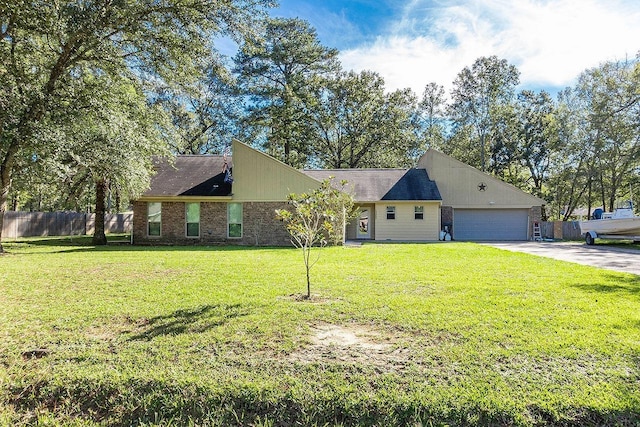 view of front of home featuring a front lawn and a garage