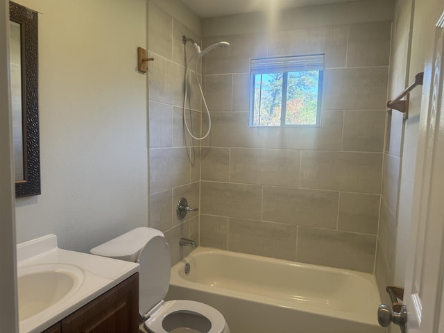 full bathroom with vanity, toilet, and tiled shower / bath