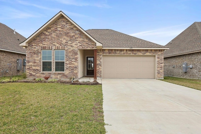 view of front of property with a front lawn and a garage