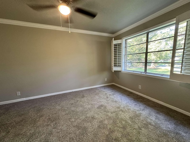 carpeted spare room featuring ceiling fan and crown molding