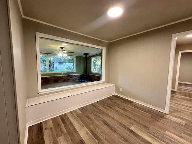 interior space featuring hardwood / wood-style floors and ornamental molding