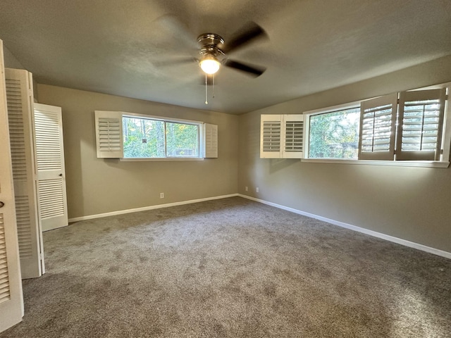 unfurnished bedroom with ceiling fan, carpet floors, and a closet