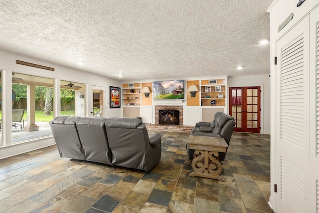 1280 Cherokee Ln, Beaumont, TX 77702 - living room with a textured ceiling, french doors, dark stone finish flooring, a fireplace, and recessed lighting