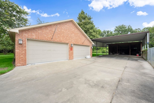 1280 Cherokee Ln, Beaumont, TX 77702 - garage featuring a detached garage and driveway