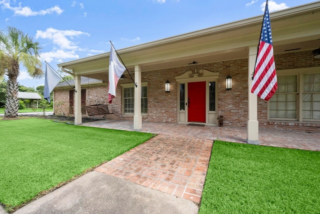1280 Cherokee Ln, Beaumont, TX 77702 - entrance to property featuring a lawn and brick siding