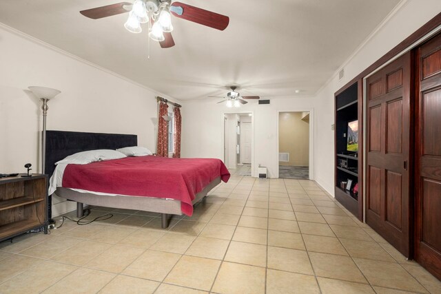 1280 Cherokee Ln, Beaumont, TX 77702 - bedroom featuring light tile patterned floors, ornamental molding, a ceiling fan, and connected bathroom