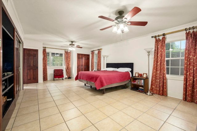 1280 Cherokee Ln, Beaumont, TX 77702 - bedroom with light tile patterned floors, multiple windows, crown molding, and ceiling fan