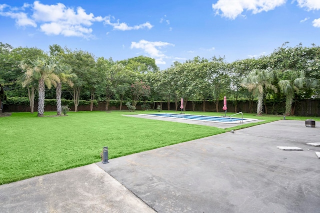 1280 Cherokee Ln, Beaumont, TX 77702 - fenced backyard featuring a patio and view of wooded area