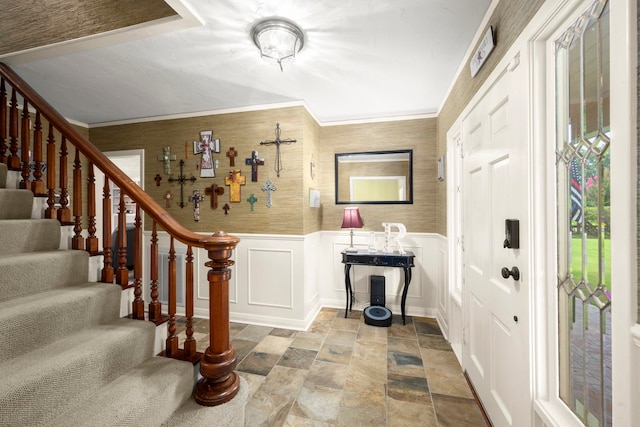 1280 Cherokee Ln, Beaumont, TX 77702 - entrance foyer featuring stone finish flooring, stairway, ornamental molding, a decorative wall, and a wainscoted wall