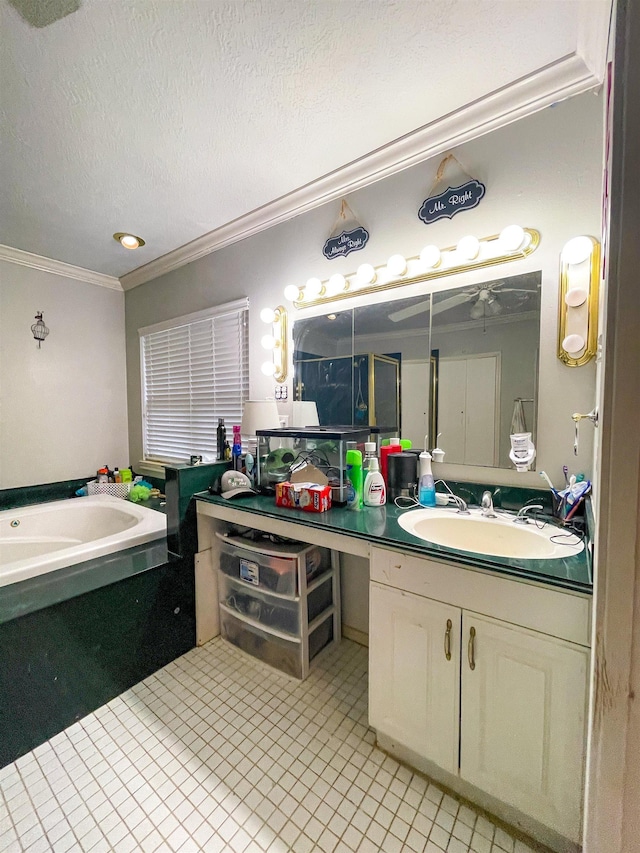 bathroom featuring a bathtub, ornamental molding, a textured ceiling, vanity, and ceiling fan