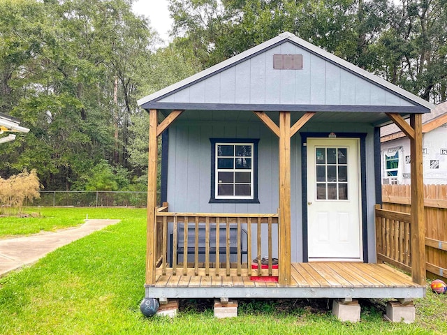 view of outbuilding featuring a lawn