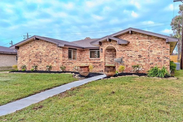 ranch-style home with a front lawn