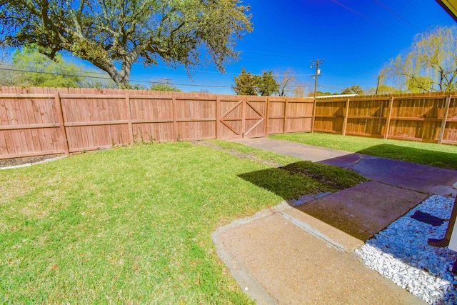 view of yard with a fenced backyard