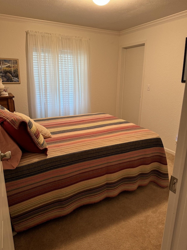 carpeted bedroom with crown molding