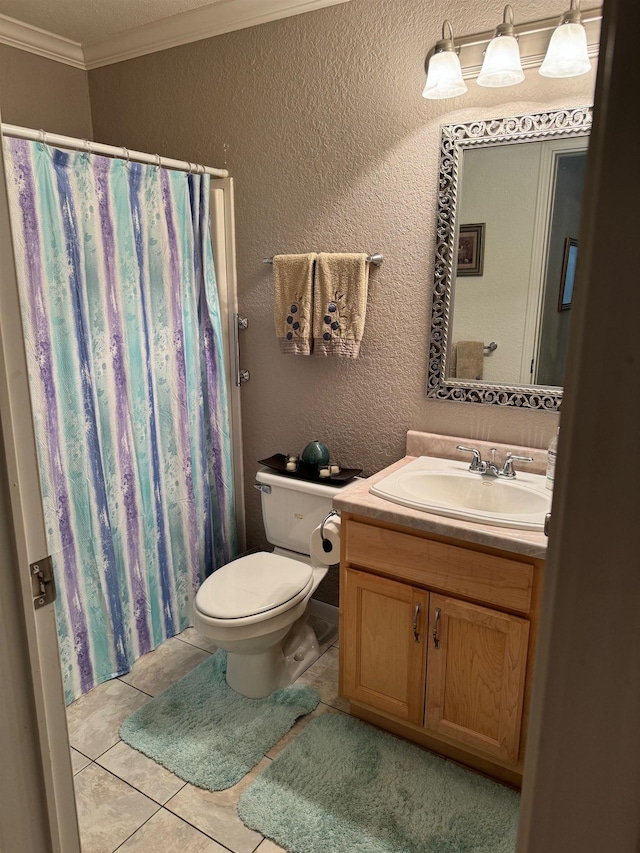 bathroom with tile patterned flooring, vanity, toilet, and crown molding