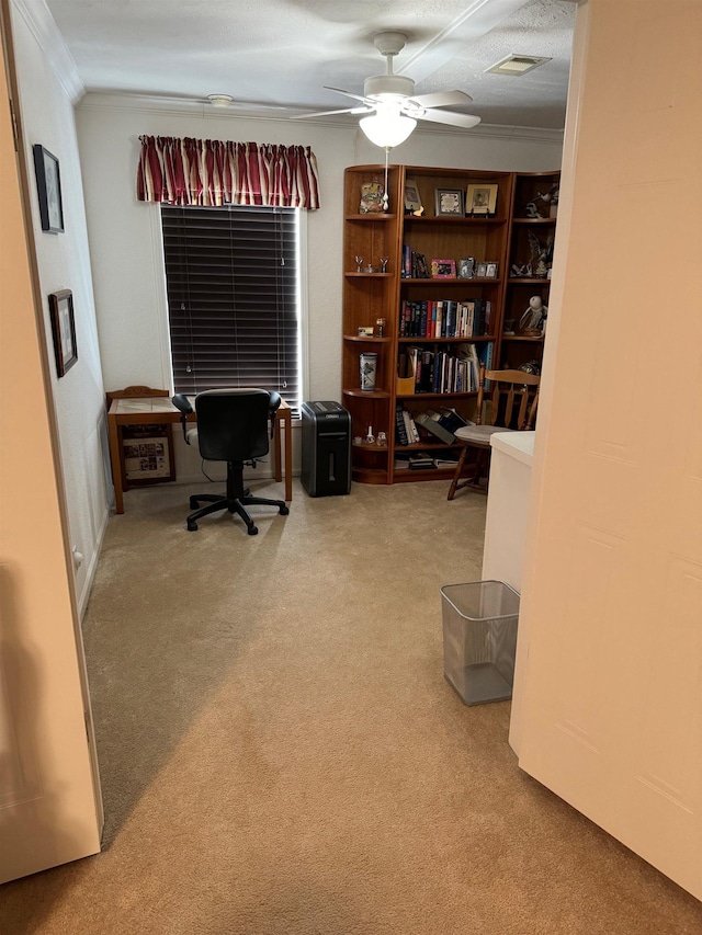 office with carpet, a textured ceiling, ceiling fan, and crown molding