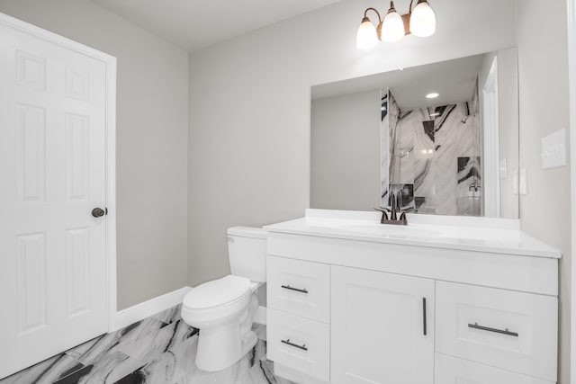 bathroom with a notable chandelier, vanity, toilet, and a shower