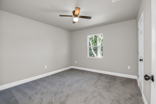 empty room with ceiling fan and carpet