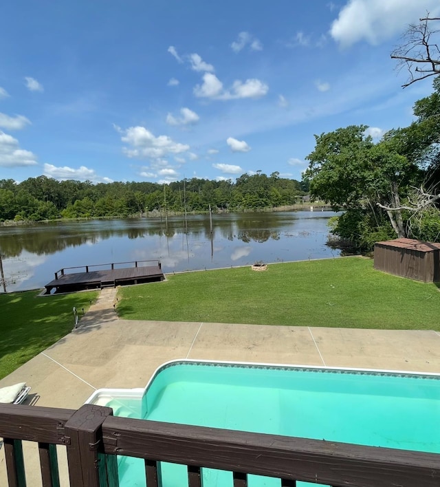 607 Cypress Bend Dr, Village Mills, TX 77663 - outdoor pool with a water view, a yard, a boat dock, and a wooded view