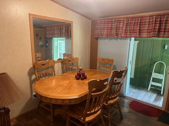 dining room with dark hardwood / wood-style flooring