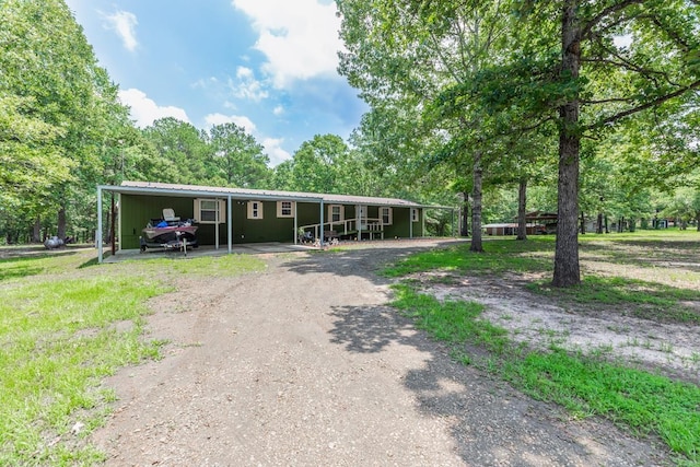 view of front of property featuring a carport