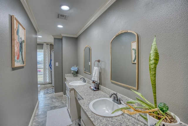 bathroom with ornamental molding and vanity