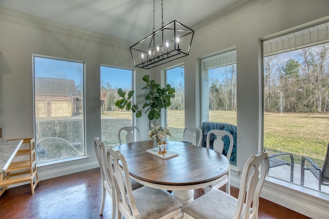 sunroom / solarium with an inviting chandelier