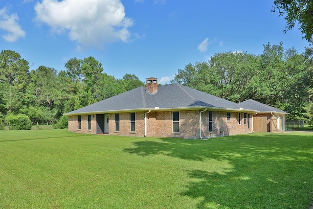 4705 Barrett St, Orange, TX 77630 - view of front of home with a garage, a front lawn, a chimney, and brick siding