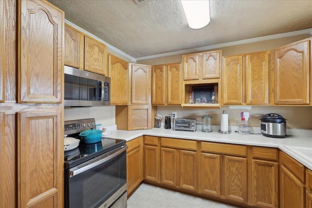 595 Blanton Pl, Beaumont, TX 77707 - kitchen with appliances with stainless steel finishes, a textured ceiling, ornamental molding, and light countertops