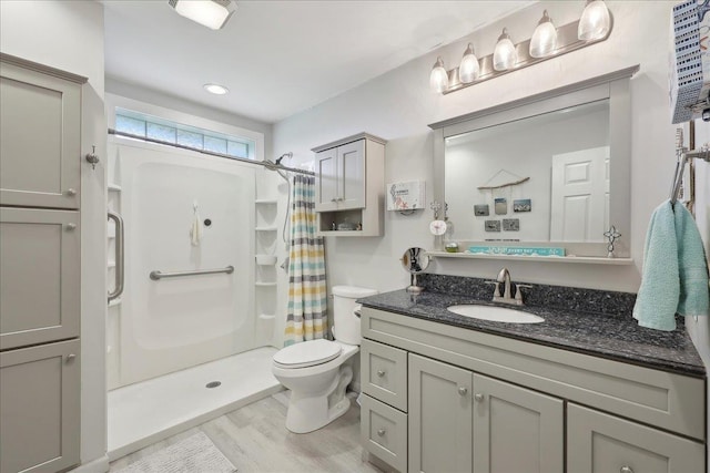 595 Blanton Pl, Beaumont, TX 77707 - bathroom featuring toilet, curtained shower, vanity, and wood finished floors