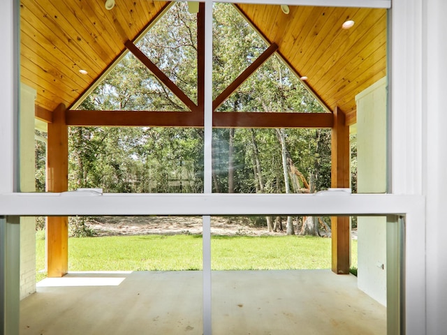 unfurnished sunroom with vaulted ceiling and wooden ceiling