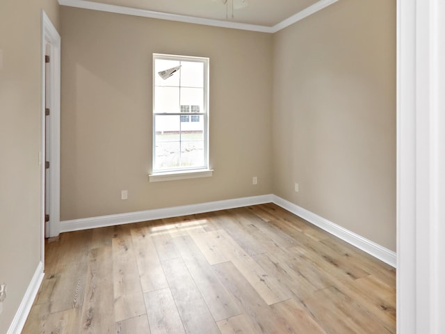 spare room with light hardwood / wood-style floors and ornamental molding