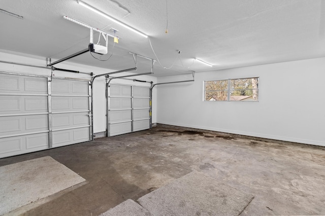 garage featuring baseboards and a garage door opener