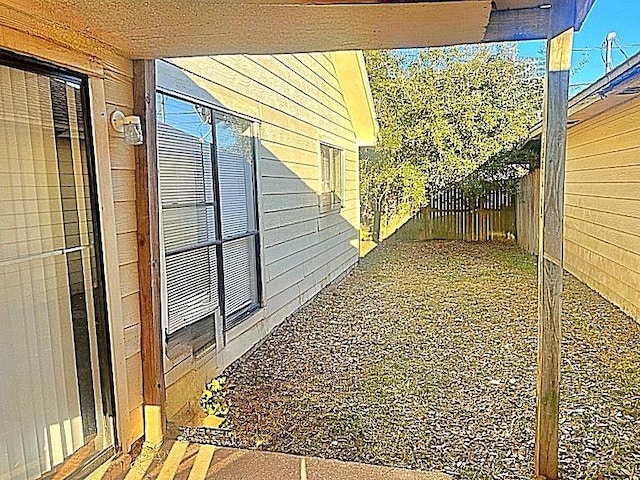 view of side of property featuring a fenced backyard