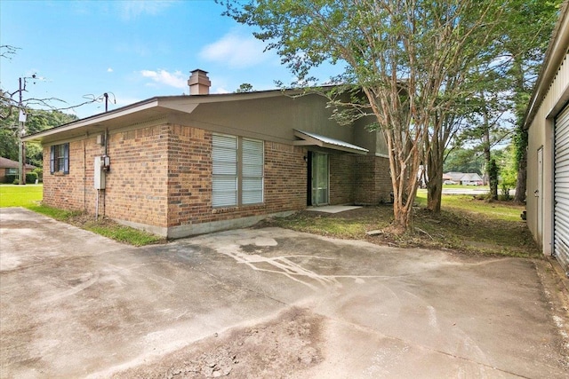 view of property exterior with a patio