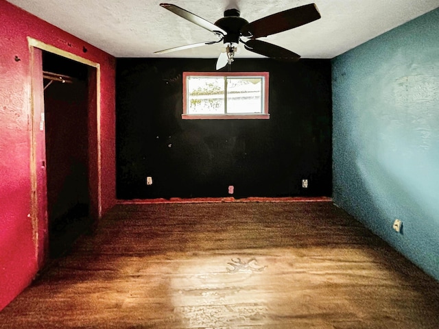 spare room featuring ceiling fan and hardwood / wood-style flooring