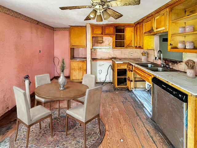 kitchen with ceiling fan, dishwasher, sink, tasteful backsplash, and dark hardwood / wood-style floors