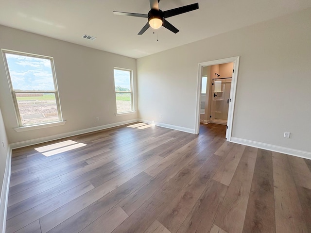 1240 Little Cypress Loop, Orange, TX 77632 - unfurnished room with wood finished floors, ceiling fan, and baseboards