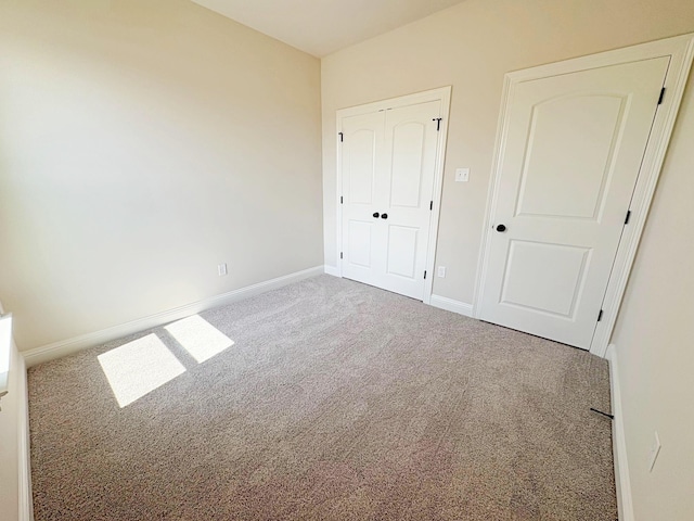 1240 Little Cypress Loop, Orange, TX 77632 - unfurnished bedroom with carpet flooring, baseboards, and a closet