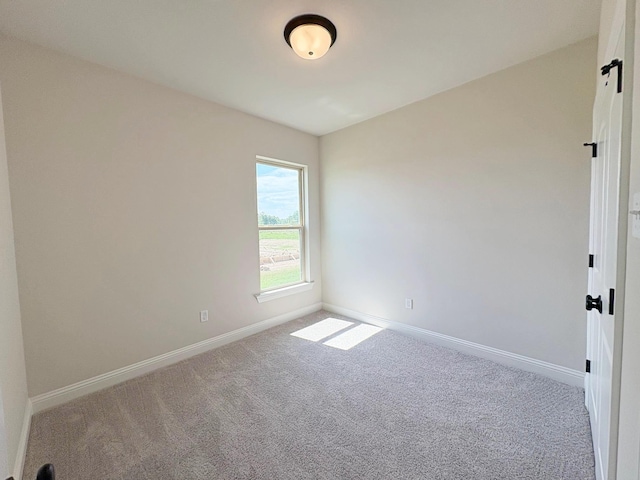 1240 Little Cypress Loop, Orange, TX 77632 - spare room with carpet flooring and baseboards
