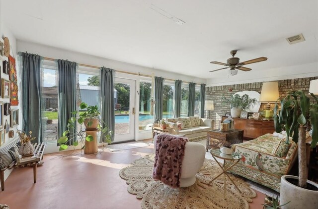 sunroom featuring french doors, visible vents, and a healthy amount of sunlight