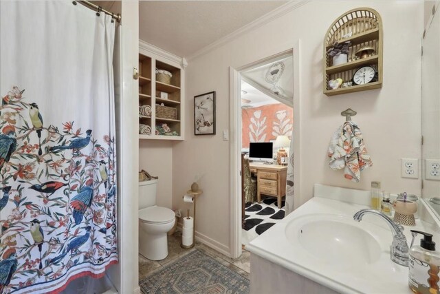 bathroom featuring toilet, ornamental molding, a shower with shower curtain, and vanity