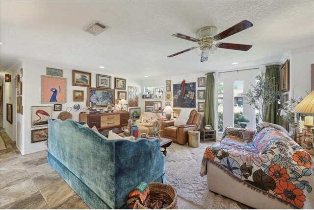 living room featuring ceiling fan, recessed lighting, a textured ceiling, and visible vents