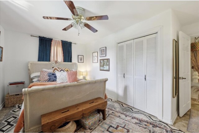 bedroom featuring a closet, baseboards, and ceiling fan